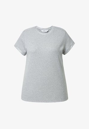 Camiseta de manga corta gris hecha de tejido suave. Presenta un escote redondo y un corte holgado. La costura es visible a lo largo de las mangas y el dobladillo.