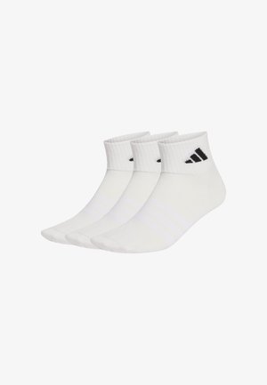 White athletic socks with a ribbed cuff and three stripes. Features black logo accents. Soft, lightweight cotton blend material.