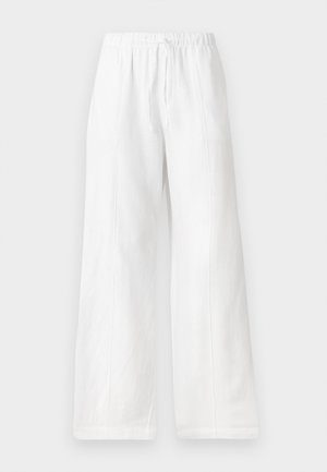 Fehér vászon, bő szabású nadrág, elasztikus derékkal és zsinórral, oldalsó varratokkal és sima textúrával. Zsebek nélküli.