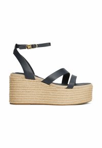 Sandali wedge in pelle blu con cinturini incrociati e una piattaforma in juta testurizzata, dotati di una chiusura con fibbia sul cinturino alla caviglia.