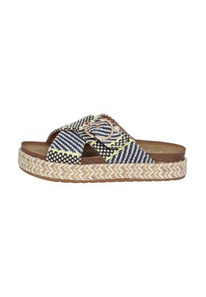 Platform sandals with a woven navy and black fabric upper, accented with yellow threads and a decorative circular buckle, featuring a braided jute sole.