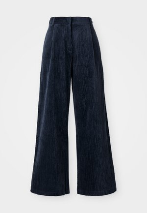 Brede corduroy broek in donkerblauw. Heeft een verticale ribbelstructuur en een hoge tailleband, wat zorgt voor een gestructureerde, losse pasvorm.