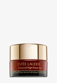 Estee Lauder Advanced Night Repair Eye i en rund, mörk bärnstensfärgad burk med ett gold lock; har produktetikett med gyllene bokstäver.