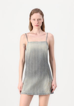 Denim dress with thin straps, featuring vertical light blue and dark blue stripes, a square neckline, and a subtle logo detail on the chest.