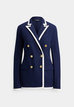 Mornarskoplava plava jakna s bijelim obrubom, dvorednim zlatnim gumbima, reverom s urezom, prslukom na prsima i dva prednja džepa s preklopom.