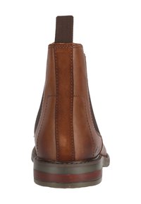 Ruskean nahkasaappaat nilkkapituudella, joissa on elastiset sivupaneelit, vetoketju takana ja kumipohja, jossa on kevyt korko.