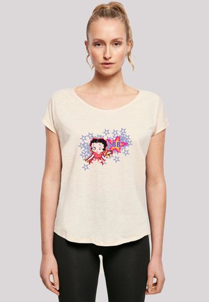 Beige T-Shirt mit kurzen Ärmeln aus weichem Material und rundem Halsausschnitt, bedruckt mit einer Grafik eines Charakters, umgeben von pinken und blauen Sternen.