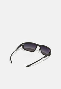 Black sunglasses with rectangular frames, gradient tinted lenses, and textured metal accents on the arms. Lightweight and sleek design.