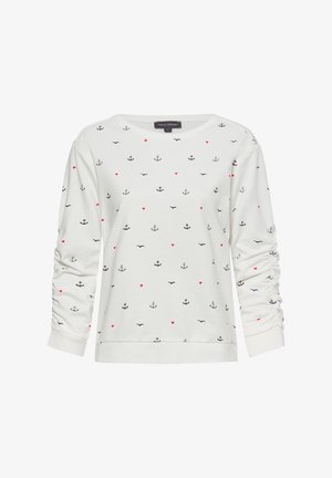 White long-sleeve top featuring black anchors, small red hearts, and birds in a scattered pattern. Soft fabric with gathered sleeves.