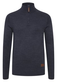 Dunkelblauer Strickpullover mit einem mittellangen Reißverschlusskragen, gerippten Bündchen und Saum. Verfügt über ein kleines braunes Markenetikett auf der unteren linken Seite.