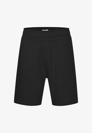 Fekete sportnadrág puha anyagból, elasztikus derékkal és egy kis dombornyomott logóval az elején. Klasszikus szabás és dizájn.