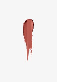 Échantillon de rouge à lèvres mat dans une couleur rose poussiéreux, avec une texture lisse et des contours légèrement irréguliers, mettant en avant une consistance poudrée.