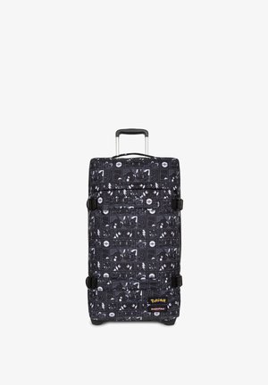 Valise souple noire avec un imprimé sur le thème de Pokémon, présentant divers personnages. Comprend une poignée rétractable et des sangles latérales pour plus de sécurité.