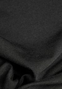 Black fabric with a smooth texture, featuring ribbed and woven patterns. The material appears soft and slightly elastic.