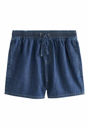 Tumesinised teksapüksid, millel on elastne vöökoht ja esiküljel pael, küljetaskud ning nähtav õmblus.