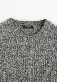 Gray knitted sweater with a ribbed texture and a crew neckline. Label reads "Massimo Dutti." Visible stitching pattern and soft material.
