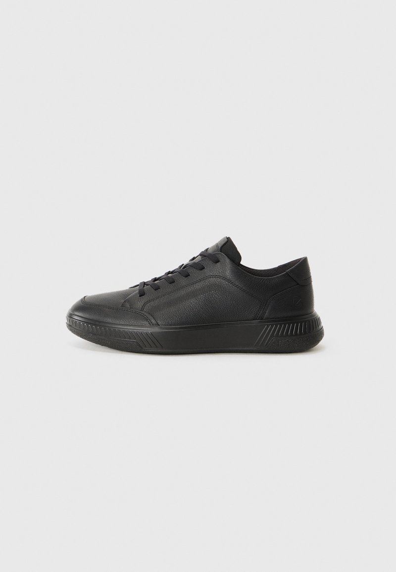 Black leather sneakers with a rounded toe, textured upper, lace-up design, and a chunky sole featuring geometric accents.