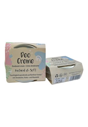 Deodorant cream in a tan cardboard box with pastel-colored designs. Features a silver container with a clear lid; labeled "Natural & Soft."