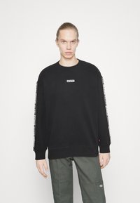 Levi's® RELAXED GRAPHIC CREWNECK SWEATSHIRT - Felpa -  caviar