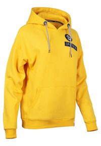 Yellow hoodie with a front pouch pocket, drawstring hood, and embroidered logo patch. Features ribbed cuffs and hem. Soft fabric texture.