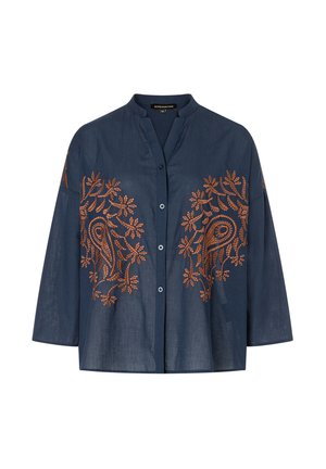 Marineblouse met een mandarinnekraag, met ingewikkelde oranje bloemenborduursel aan de voorkant en driekwartmouwen. Knoopsluitingen.