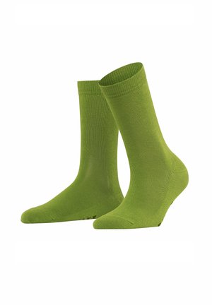 Grüne Baumwollsocken mit glatter Textur, gerippten Bündchen und nahtlosem Zehendesign. Mit verstärktem Fersenbereich und dezentem Branding an der Unterseite.