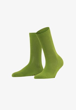 Green cotton socks with a smooth texture, ribbed cuffs, and a seamless toe design. Features reinforced heel and subtle branding at the base.