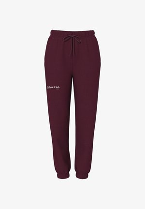 Pantalones deportivos burdeos de tela suave con cintura elástica, cordón ajustable y un logo blanco en la pierna izquierda.