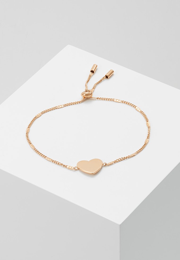 Rose gold bracelet featuring a heart-shaped charm, delicate chain, and adjustable sliding closure for secure fit.