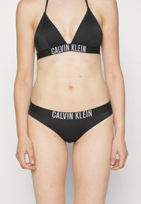 Calvin Klein Swimwear - INTENSE POWER SWIM - Bikinialaosa - black Pienoiskuva 1