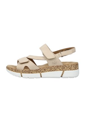 Sandale beige à bout ouvert avec brides ajustables, semelle intermédiaire texturée liège et semelle extérieure en caoutchouc blanc segmenté, vue de côté.