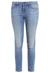 Ljust blå denim skinny jeans med en urtvättad finish, femfickorsdesign och en enkel knappstängning i midjan.
