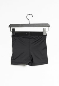 Mustat urheiluhousut, jotka on valmistettu joustavasta materiaalista, ja joissa on matala vyötärö, tiukka malli sekä pieni logo vasemmassa helmoissa.