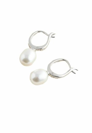 Silver lever-back earrings each with a single white baroque pearl dangling.