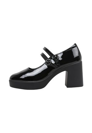 Zapatos Mary Jane de charol negro con dos correas de hebilla, punta redondeada y tacón cuadrado grueso. Acabado suave y detalles mínimos.