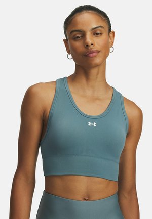 Under Armour VANISH SEAMLESS MID - Medium support sports bra - jasper blue