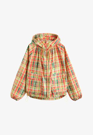Bunda s kapucňou s viacznačným žltým, oranžovým a zeleným kockovaným vzorom, predný zips, dve náprsné vrecká s klopami, elastické manžety a sťahovacie šnúrky na kapucni a na leme.