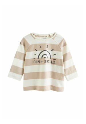 Beigen ja kermanvärisen raidoitettu pitkähihaispaita, jossa pyöreä pääntie. Päällä mustat tekstit "FUN + SMILES" ja aurinkokuvio. Pehmeää puuvillakangasta.