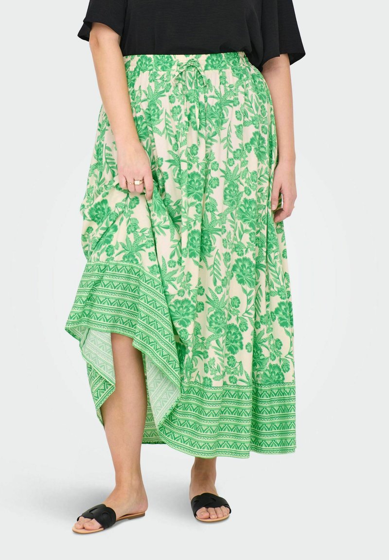 Gonna maxi floreale in crema e verde con orlo asimmetrico, caratterizzata da una vita con coulisse e motivi geometrici nella parte inferiore.