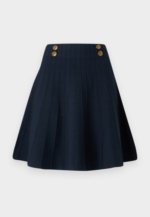 Navy pleated skirt featuring a textured fabric, high waistband, and two golden buttons at the front, creating a clean line and structured shape.