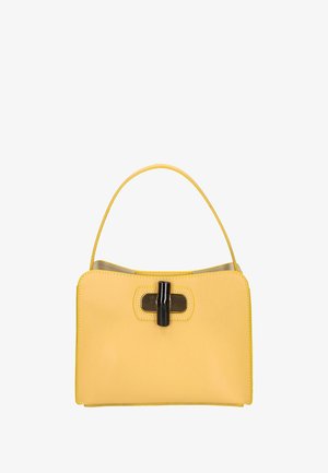 Borsa a tracolla gialla in pelle con una forma strutturata, manico arrotondato e un dettaglio centrale di chiusura nera. Texture liscia, design minimalista.