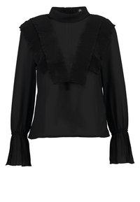 Blusa nera a maniche lunghe con dettagli a pon-pon plissettati sul davanti e polsini a manica svasata plissettati. Caratterizzata da un collo alto e chiusura con zip sul retro.