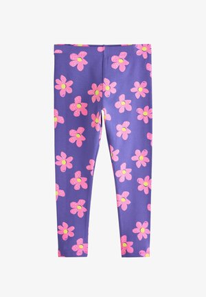 Lila Kinderleggings mit einem Muster aus großen pinken Blumen mit gelben Zentren, die gleichmäßig über den Stoff verteilt sind.
