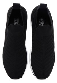 Pair of black slip-on knit sneakers with white soles, chevron pattern on fabric, and pull tabs at the heel, viewed from above.