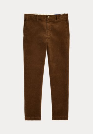 Bruine corduroy broek met knoop- en ritssluiting, riemlussen en voorzakken, plat liggend op een lichte achtergrond weergegeven.