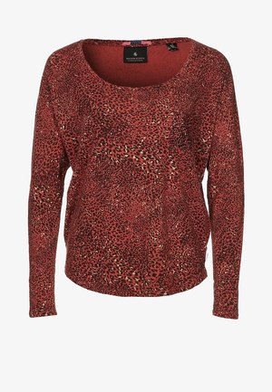 Czerwona bluzka z długim rękawem, ozdobiona wzorem w lamparta z czarnymi i beżowymi akcentami. Dekolt w serek i luźny krój. Miękka tekstura materiału.