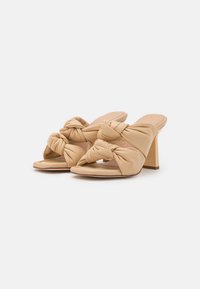 Unisa SABAS - Mules de salto - butter