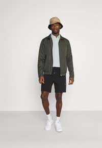 Tommy Hilfiger REGULAR - Polo - oxygen