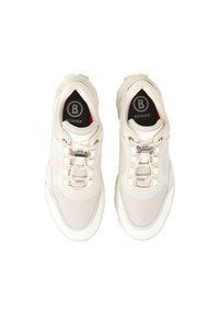 Cream-colored sneakers with mesh and synthetic material, featuring metallic eyelets, a padded collar, and logo on the insole.