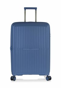 Valigia rigida di colore blu intenso, caratterizzata da un design a righe testurizzate, manico retrattile e ruote scorrevoli per un facile trasporto.